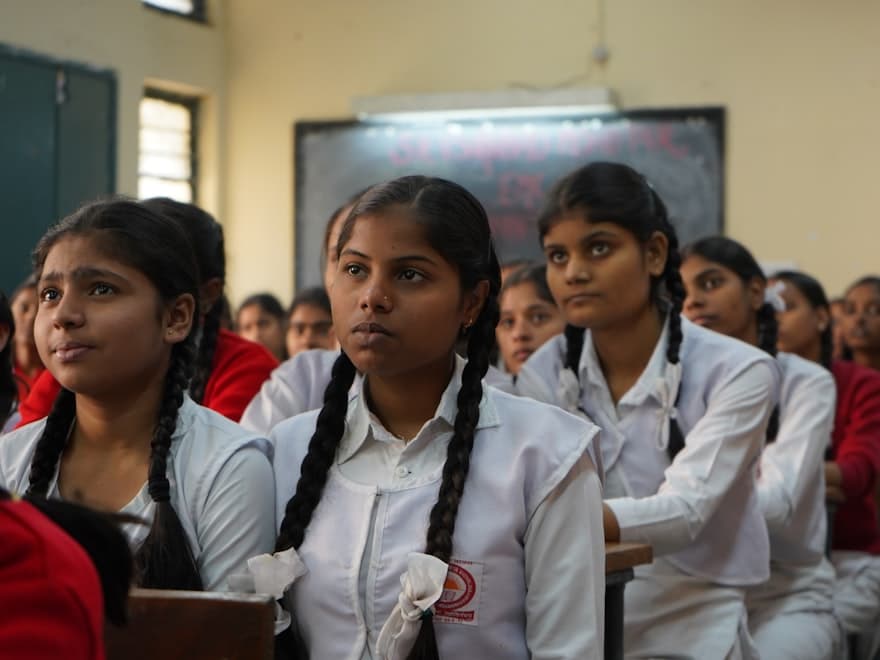 Students attending a lesson in a school classroom